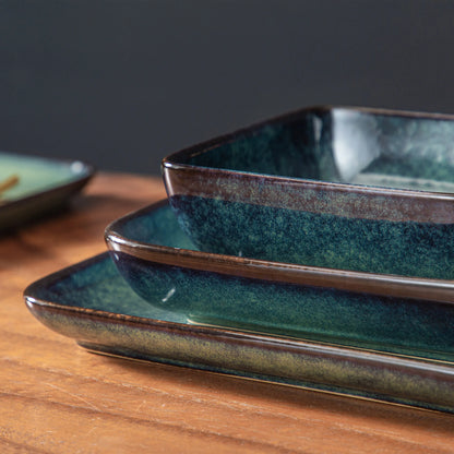 The Vancasso Stern 16-Piece Green Square Stoneware Dinnerware Set features a unique reactive glaze, providing service for four