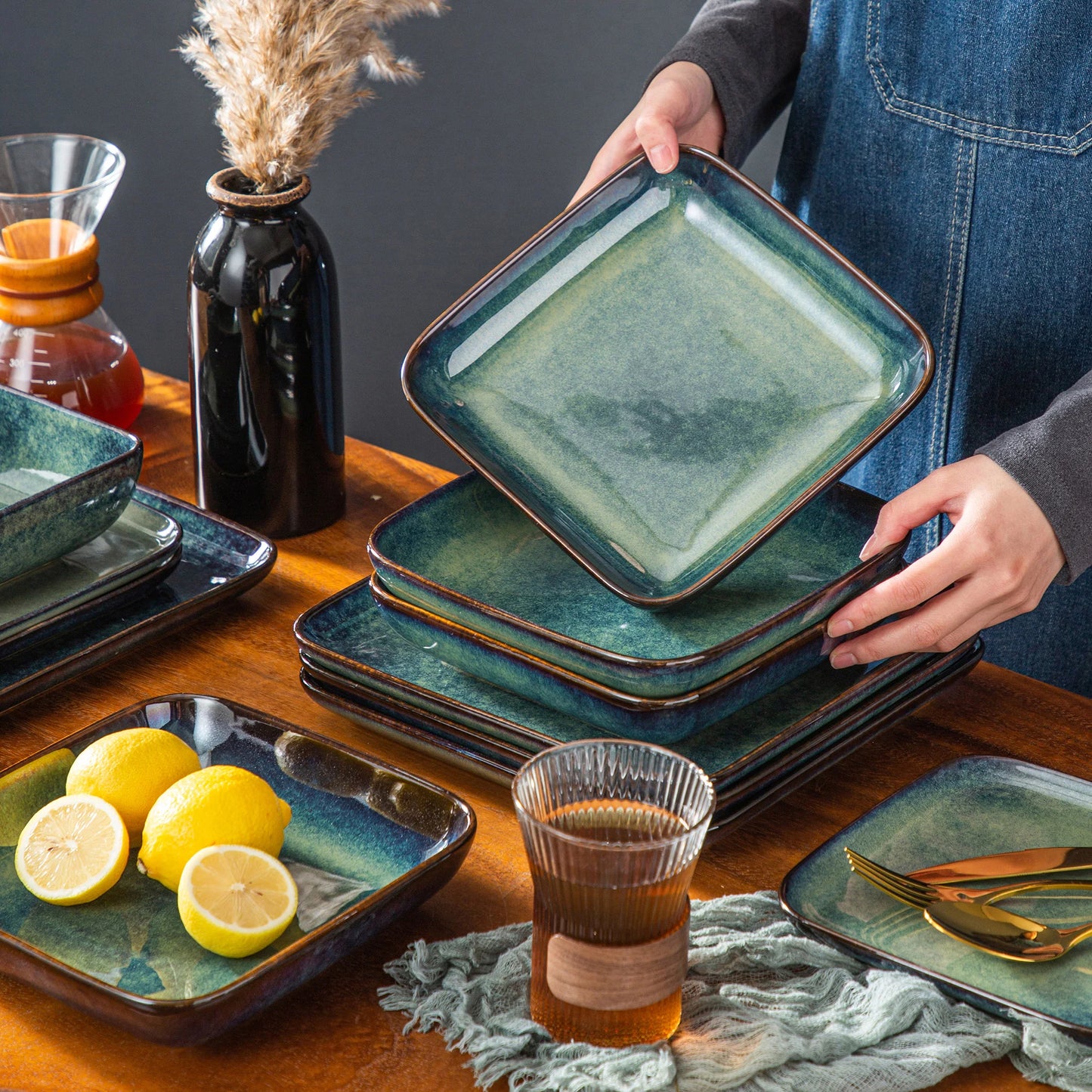 The Vancasso Stern 16-Piece Green Square Stoneware Dinnerware Set features a unique reactive glaze, providing service for four